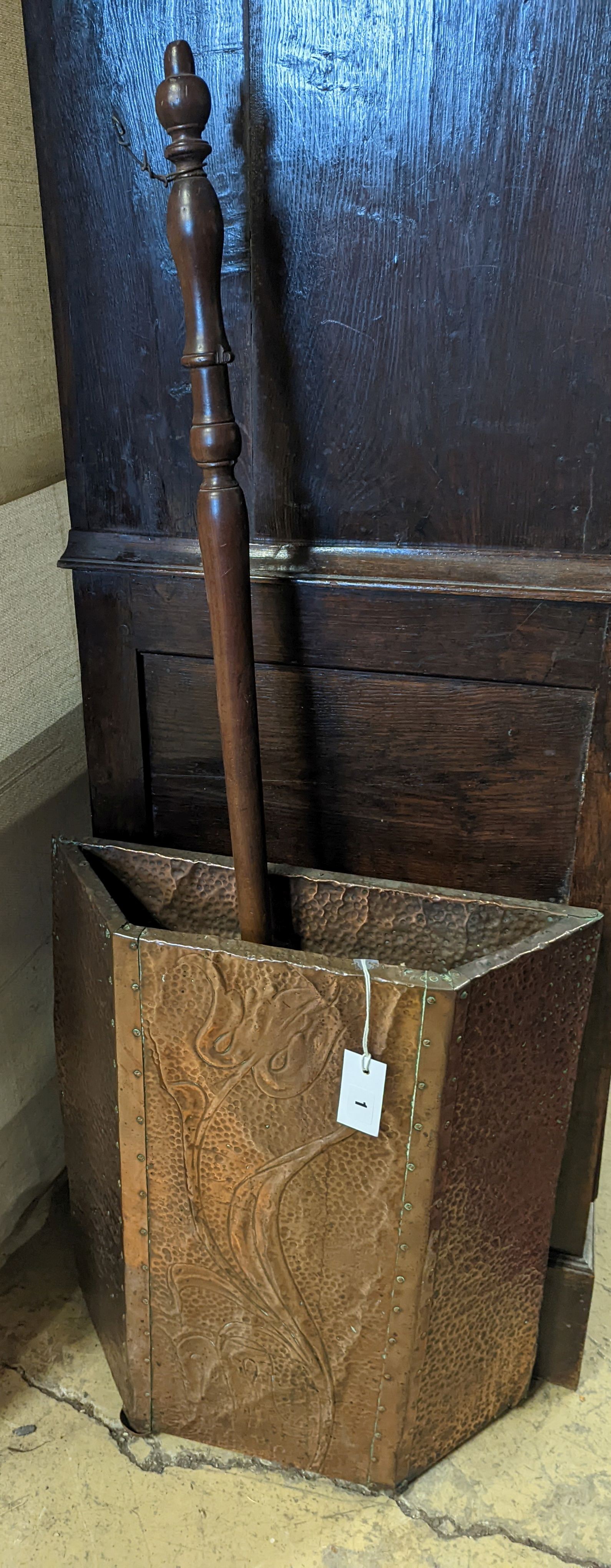 An early 20th century embossed copper stick stand, height 60cm, together with a Victorian copper warming pan